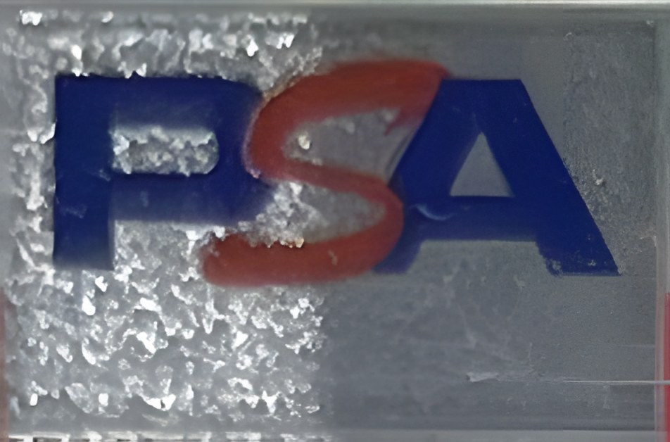 Front label at an angle, showing the illumination gradient across the holographic panels