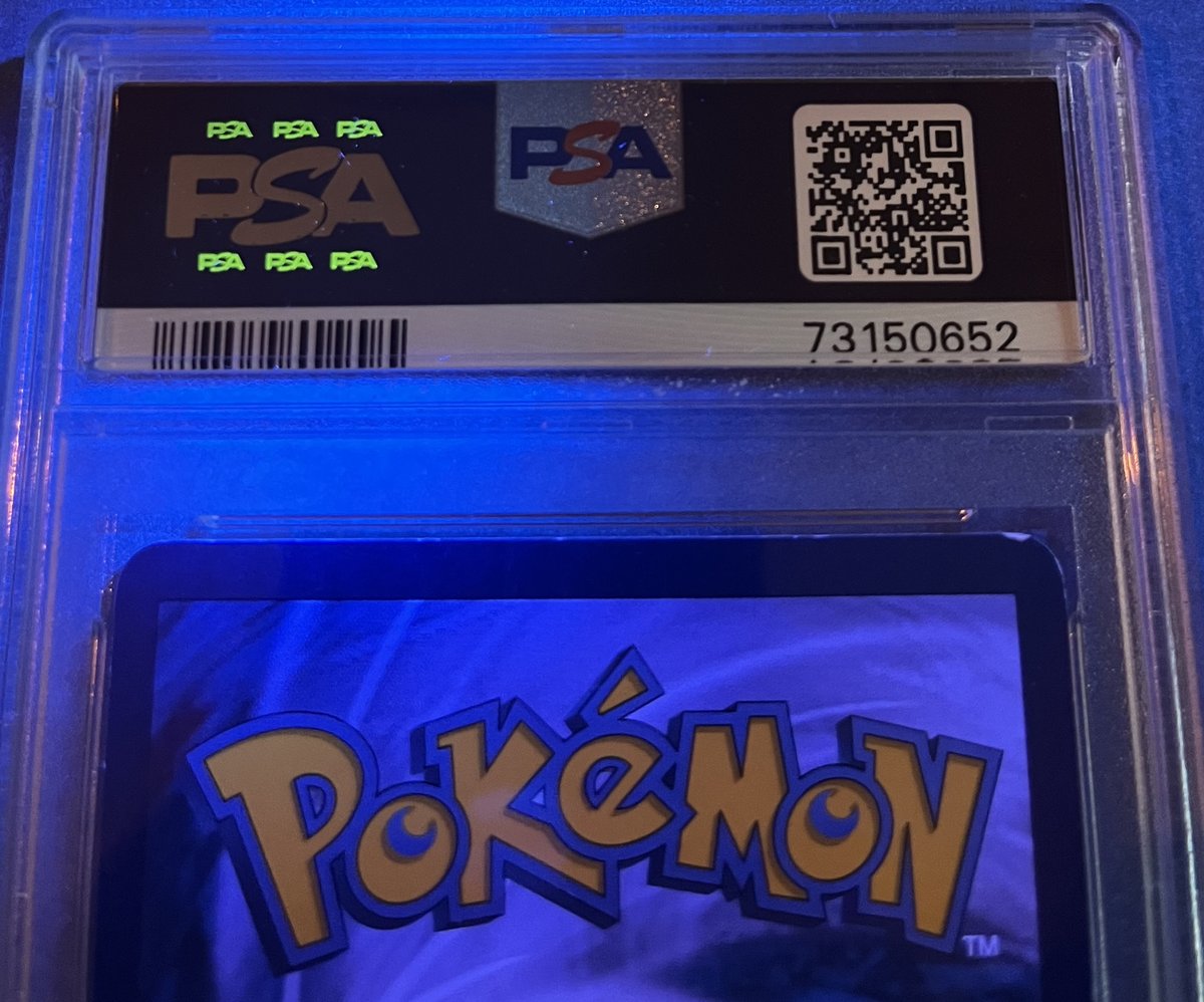 Tier 4 back — UV blacklight, PSA logos glowing